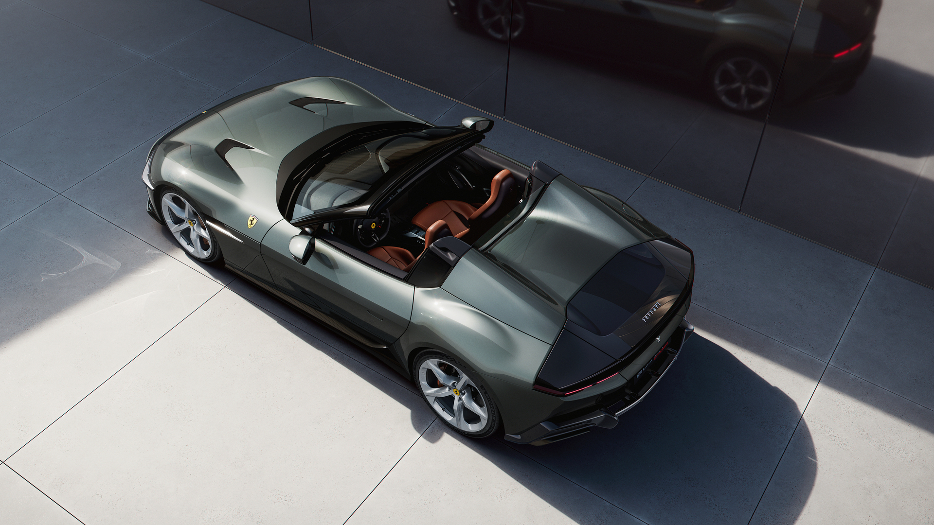 Overhead view of a gray Ferrari convertible.