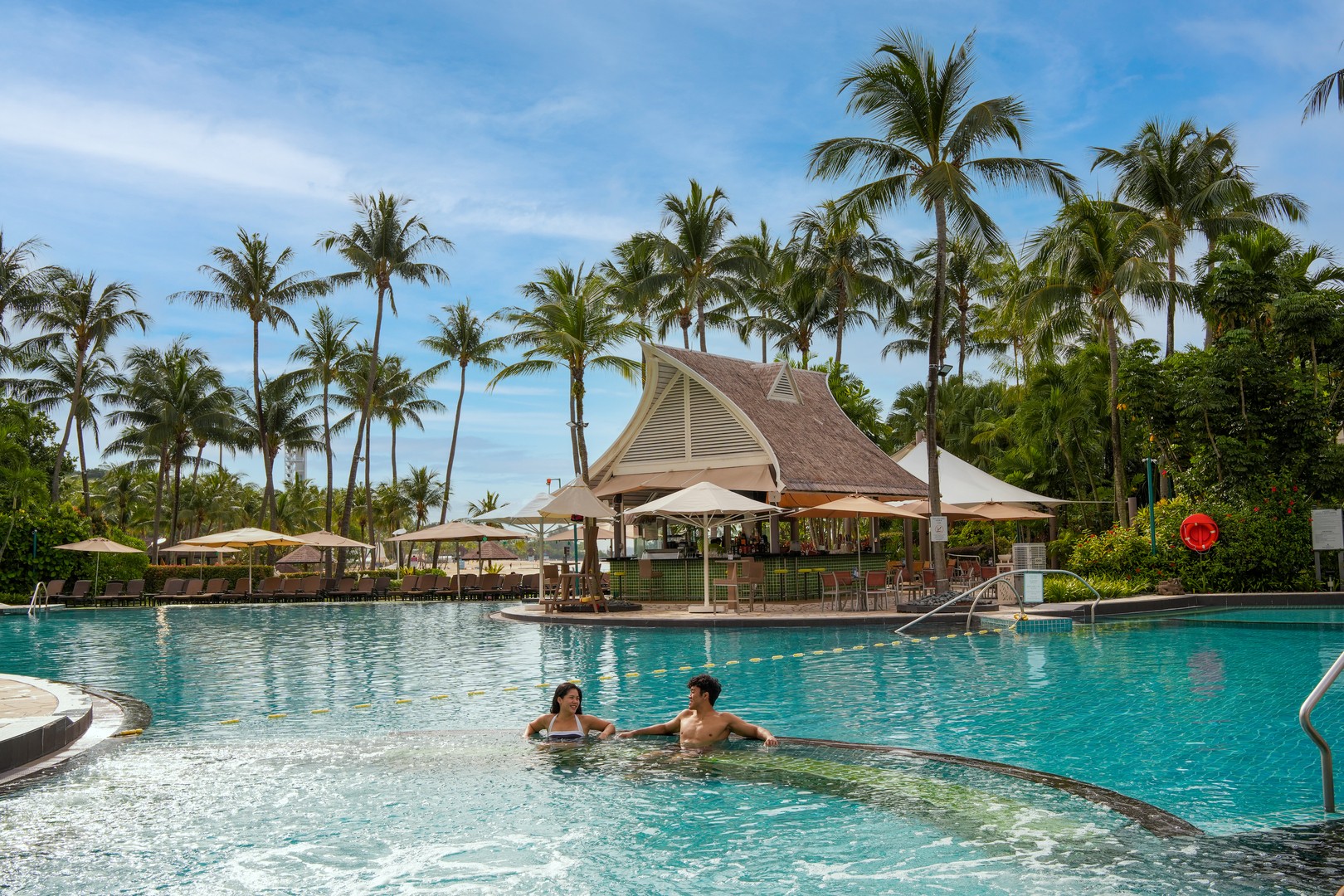 Swimming pool scene at Shangri-La Rasa Sentosa Resort in Singapore