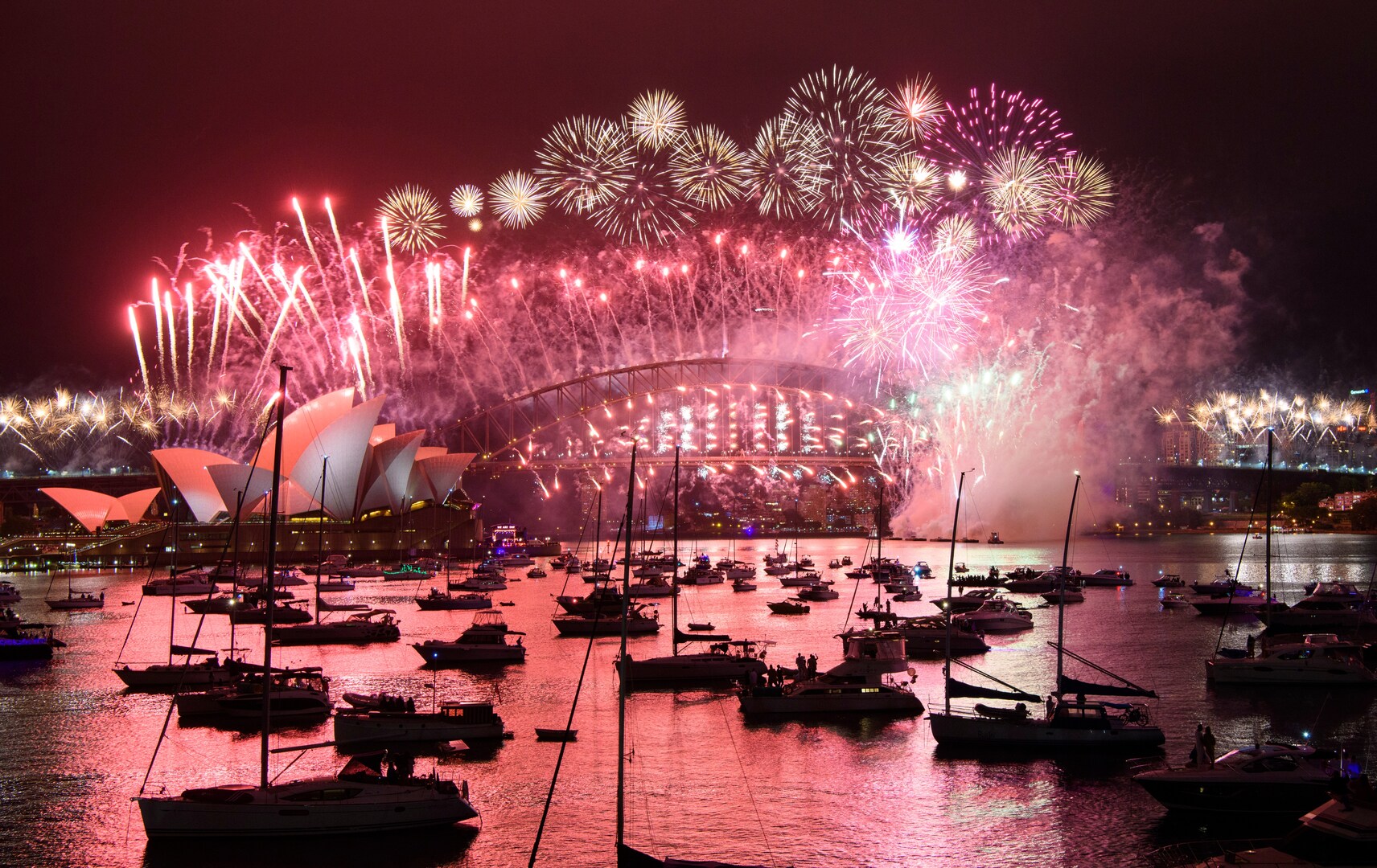 Fireworks over Sydney Harbour Bridge and Sydney Opera House during New Year's Eve celebrations.